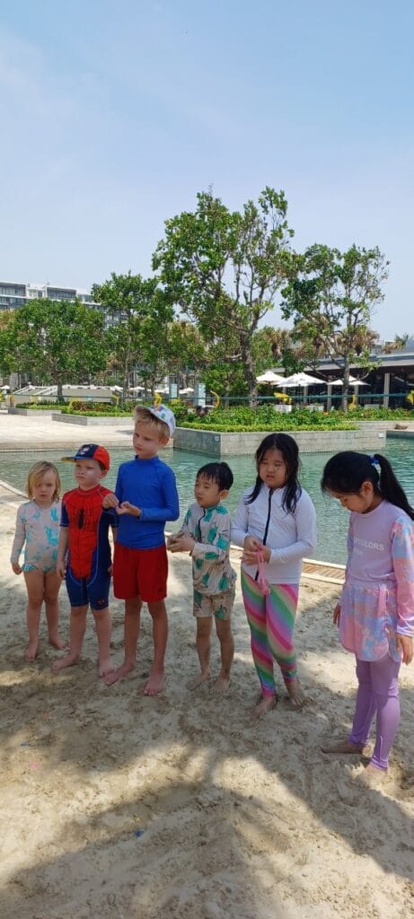 Babysitter with children on the beach in Da Nang