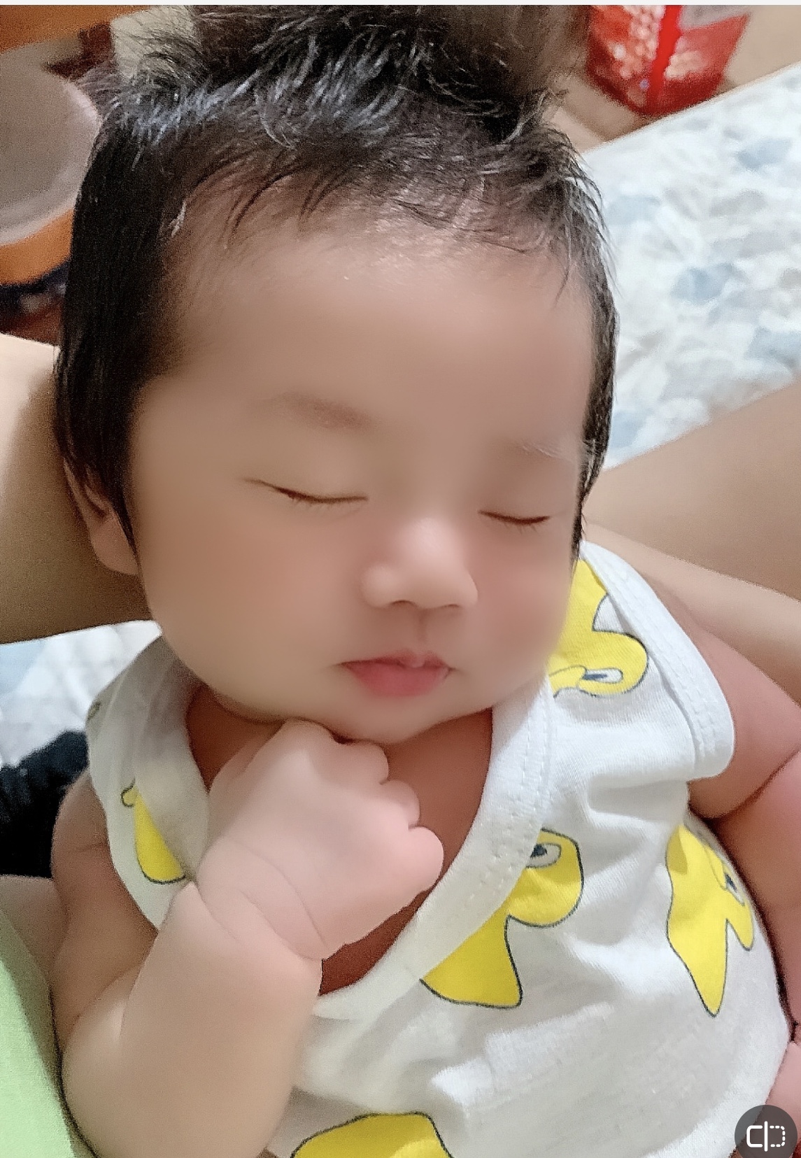 Vietnamese babysitter with baby