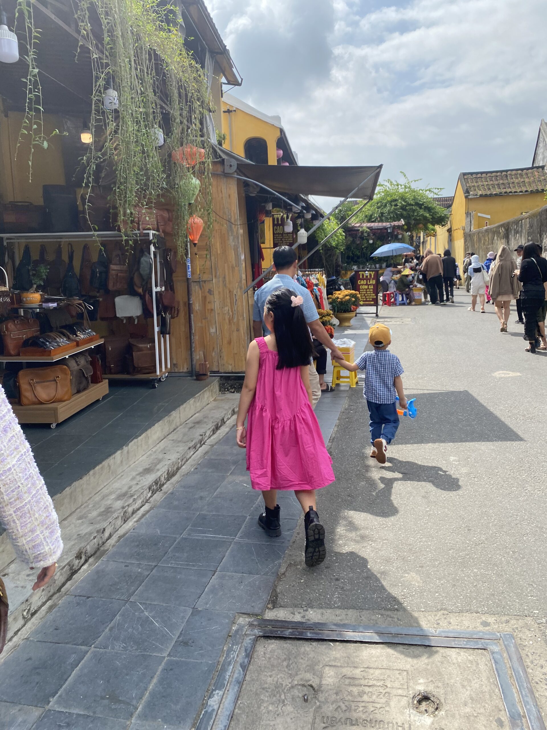 vietnam babysitter helping a toddler with calm play in a hotel room