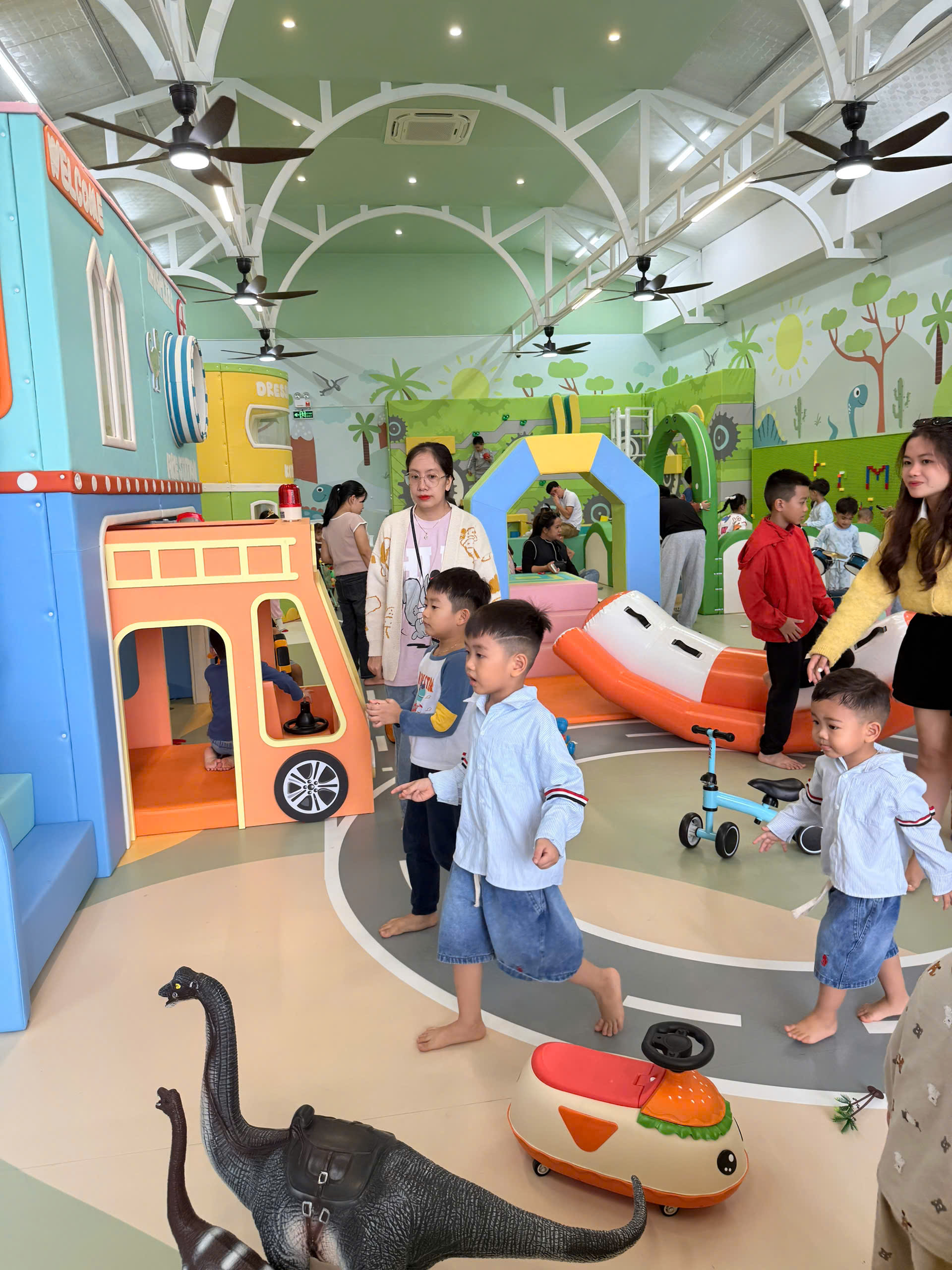 Babysitter helping siblings with crafts and board games - screen-free activity