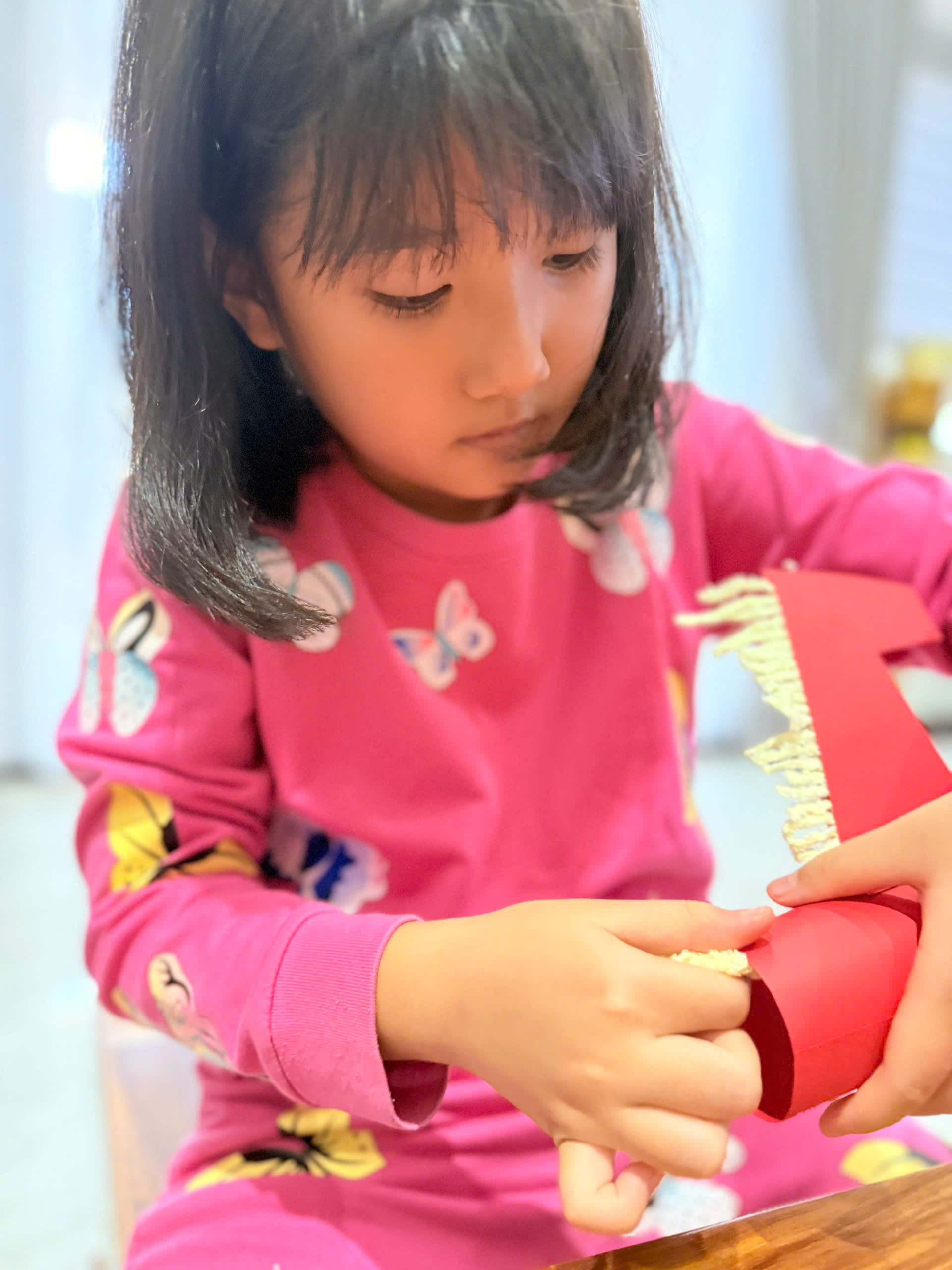 Paper horse craft activity: babysitter helps the child step-by-step