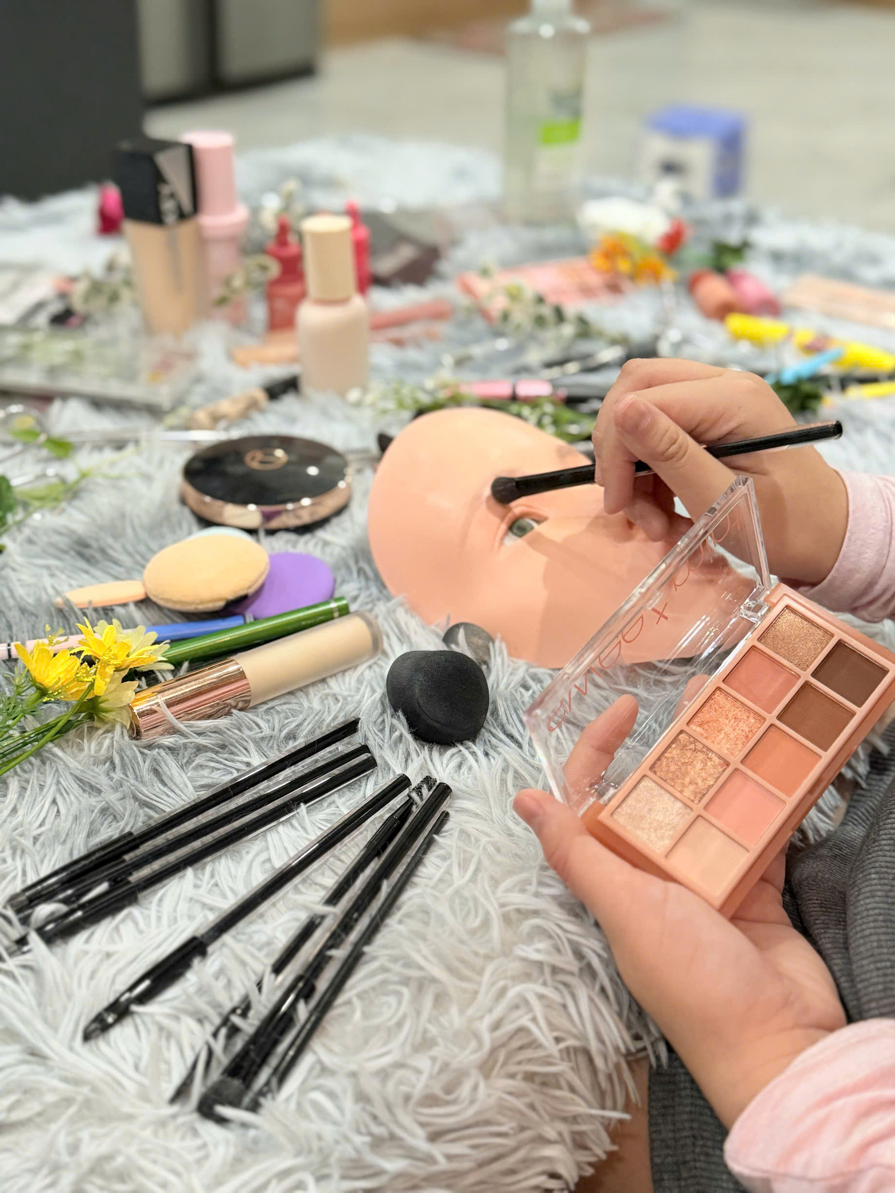 Child confidently continuing mask face-painting role play after guidance