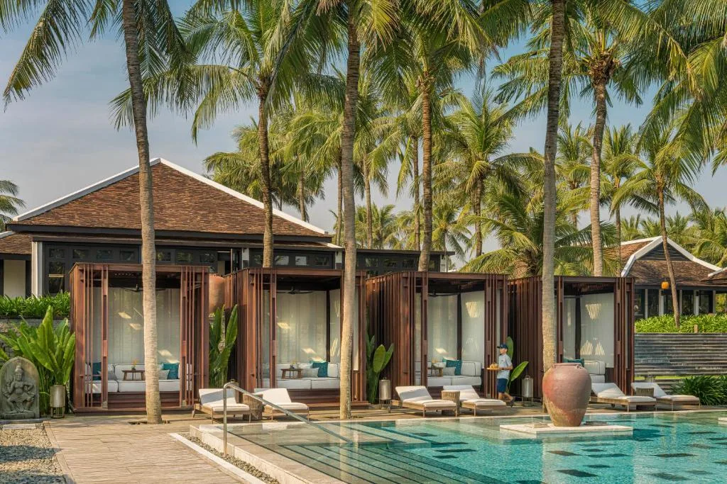 Babysitter spending calm one-to-one time with a child during a resort stay in Hoi An