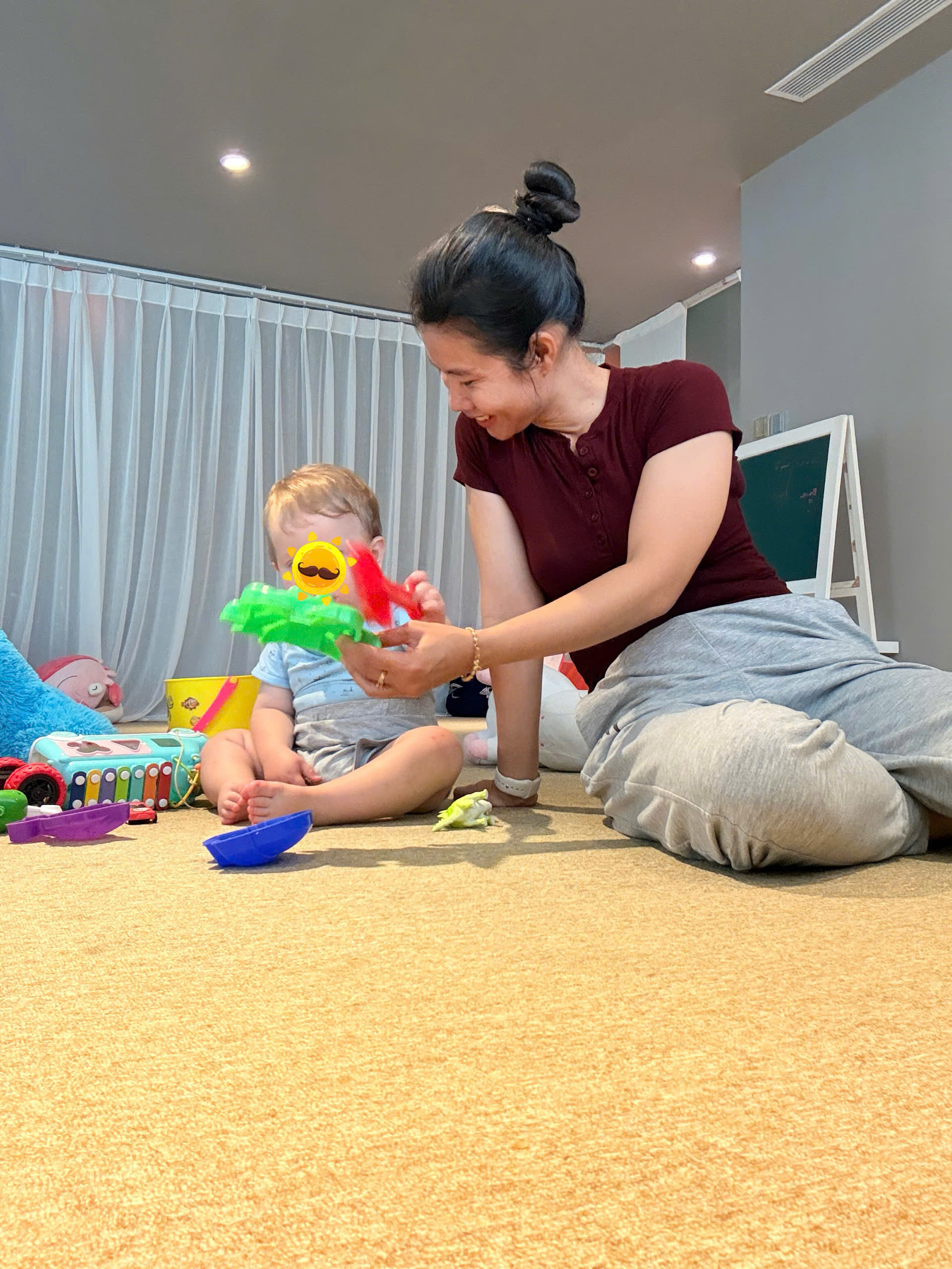 Trusted nanny at Almanity Hoi An Wellness Resort helping a tired child relax after travel