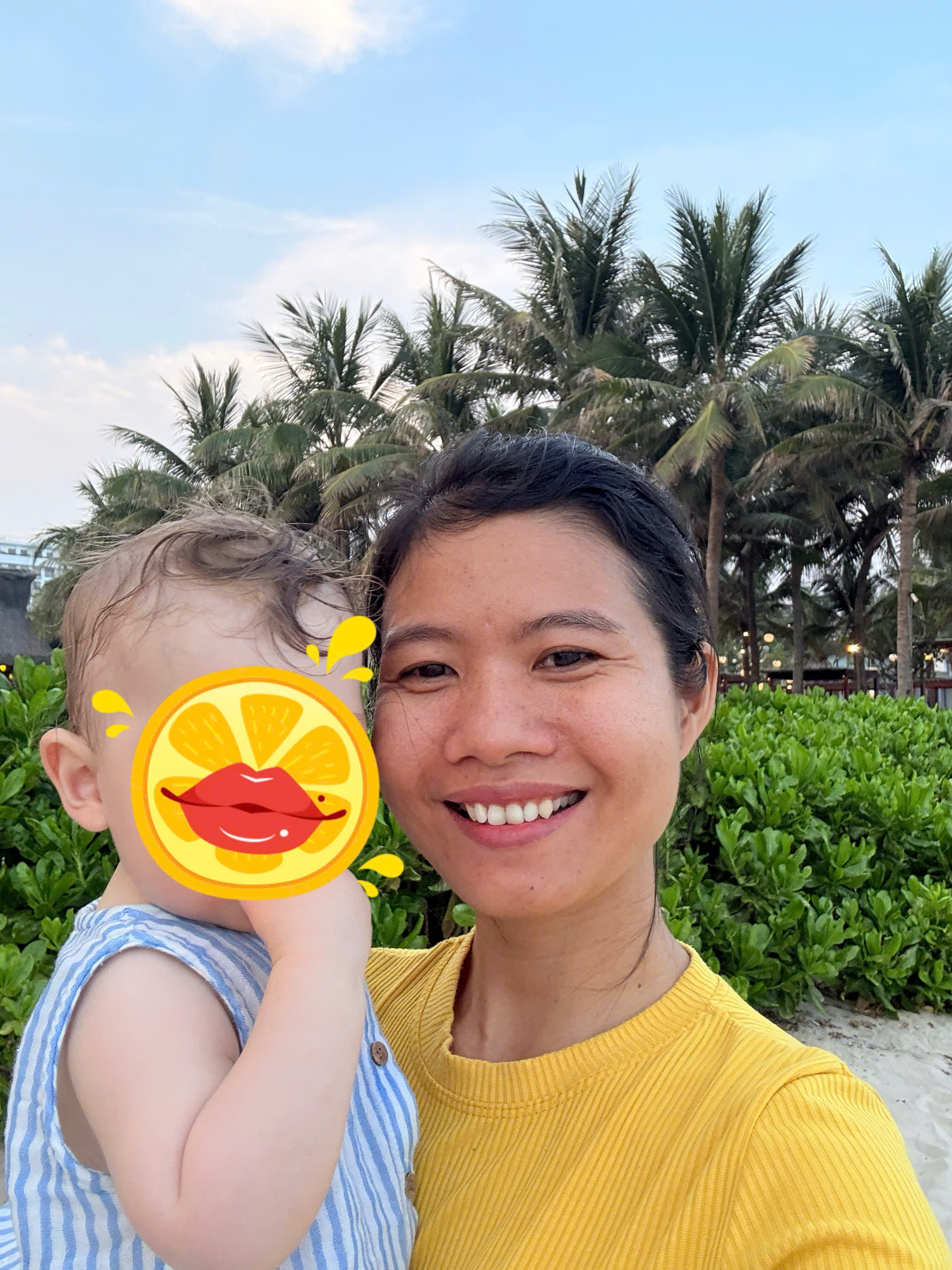 Babysitter caring for a young child in a calm private villa setting at a Da Nang wellness resort
