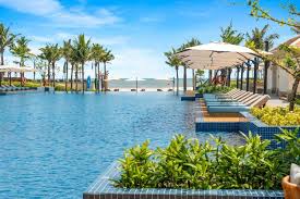 Private babysitter calmly playing with a child during a resort villa stay in Da Nang