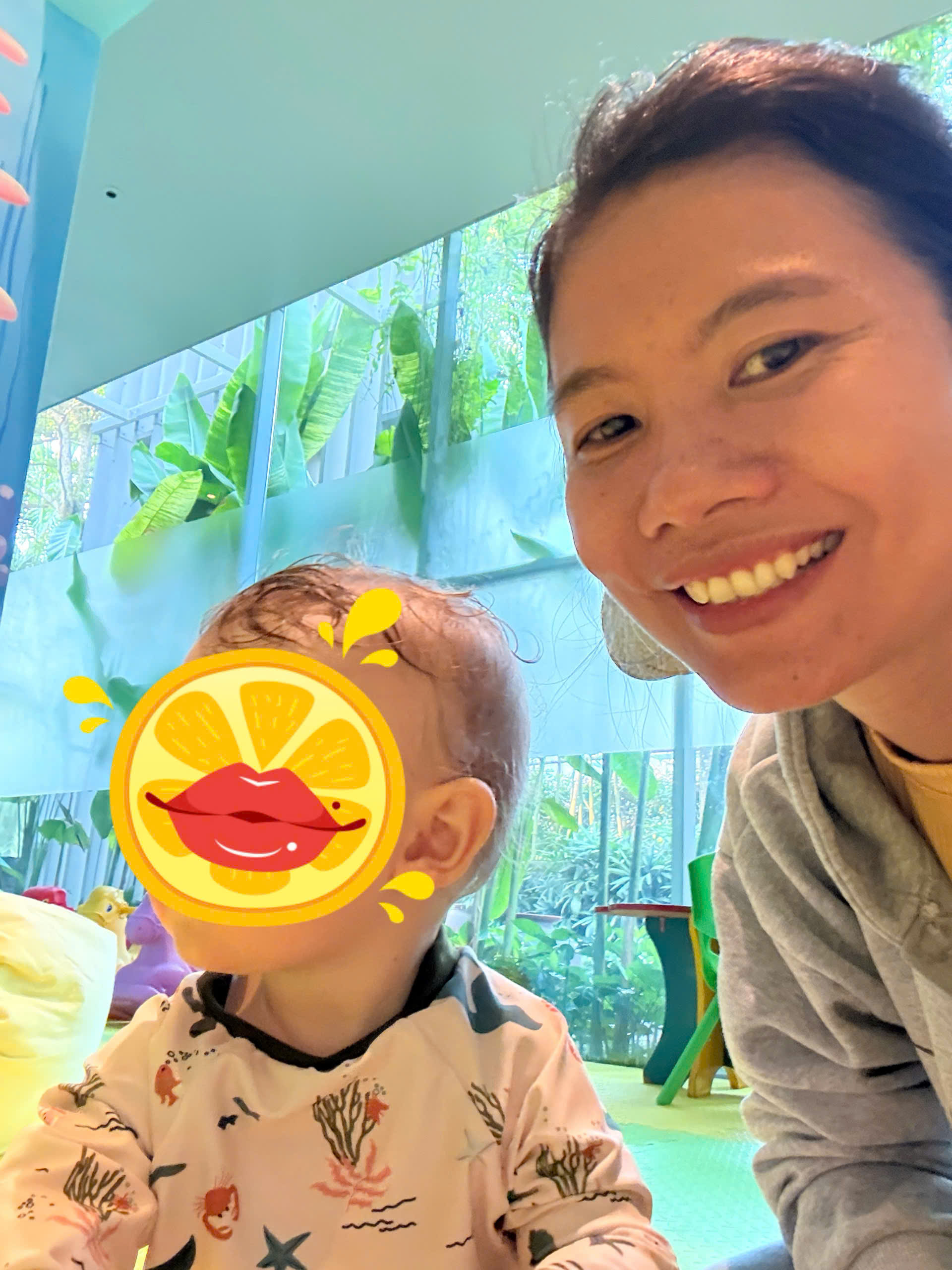 Experienced babysitter at TIA Wellness Resort feeding and caring for a baby with patience