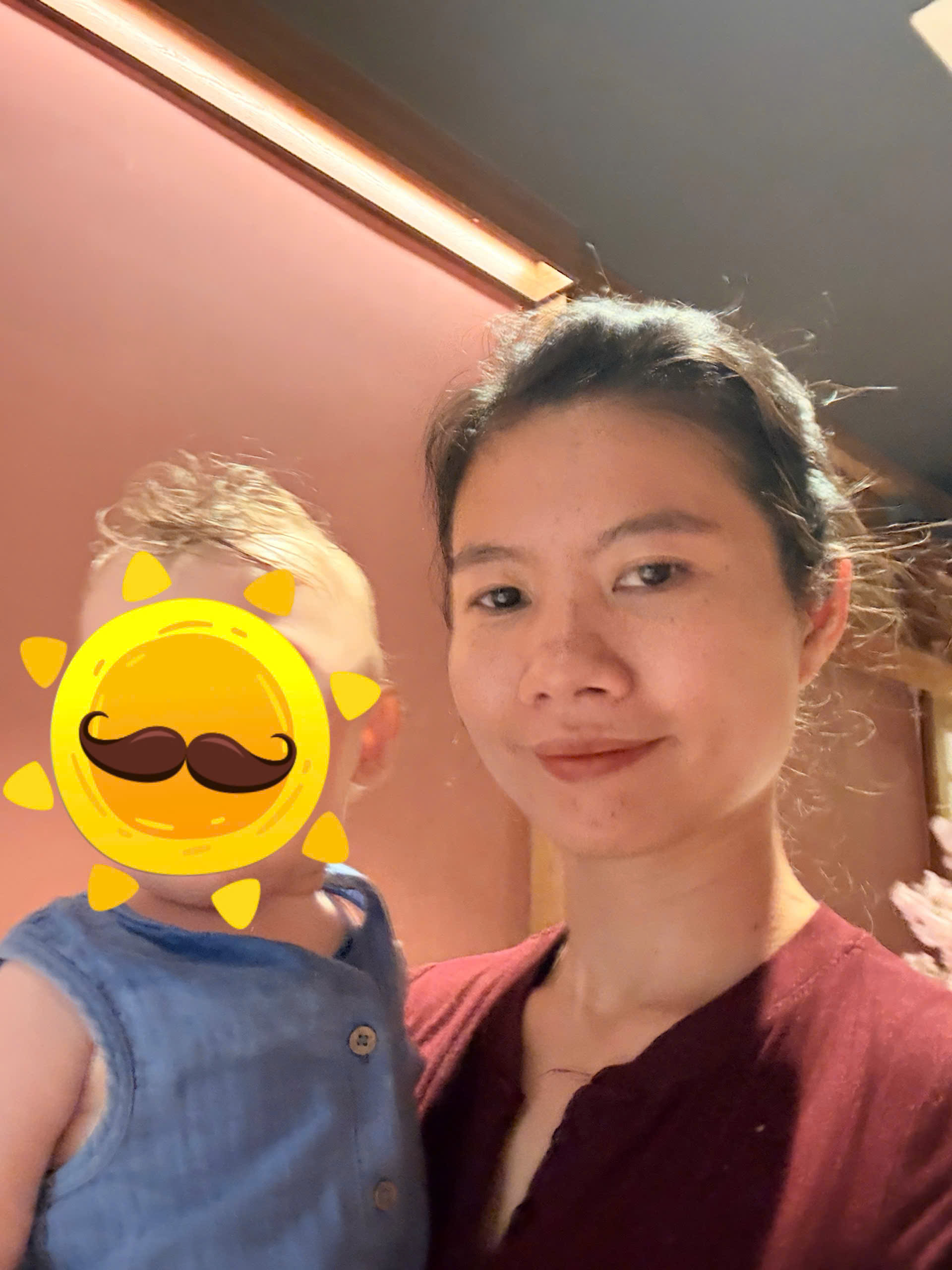 trusted babysitter playing gently with a happy toddler in a calm villa setting at Furama Villas Danang