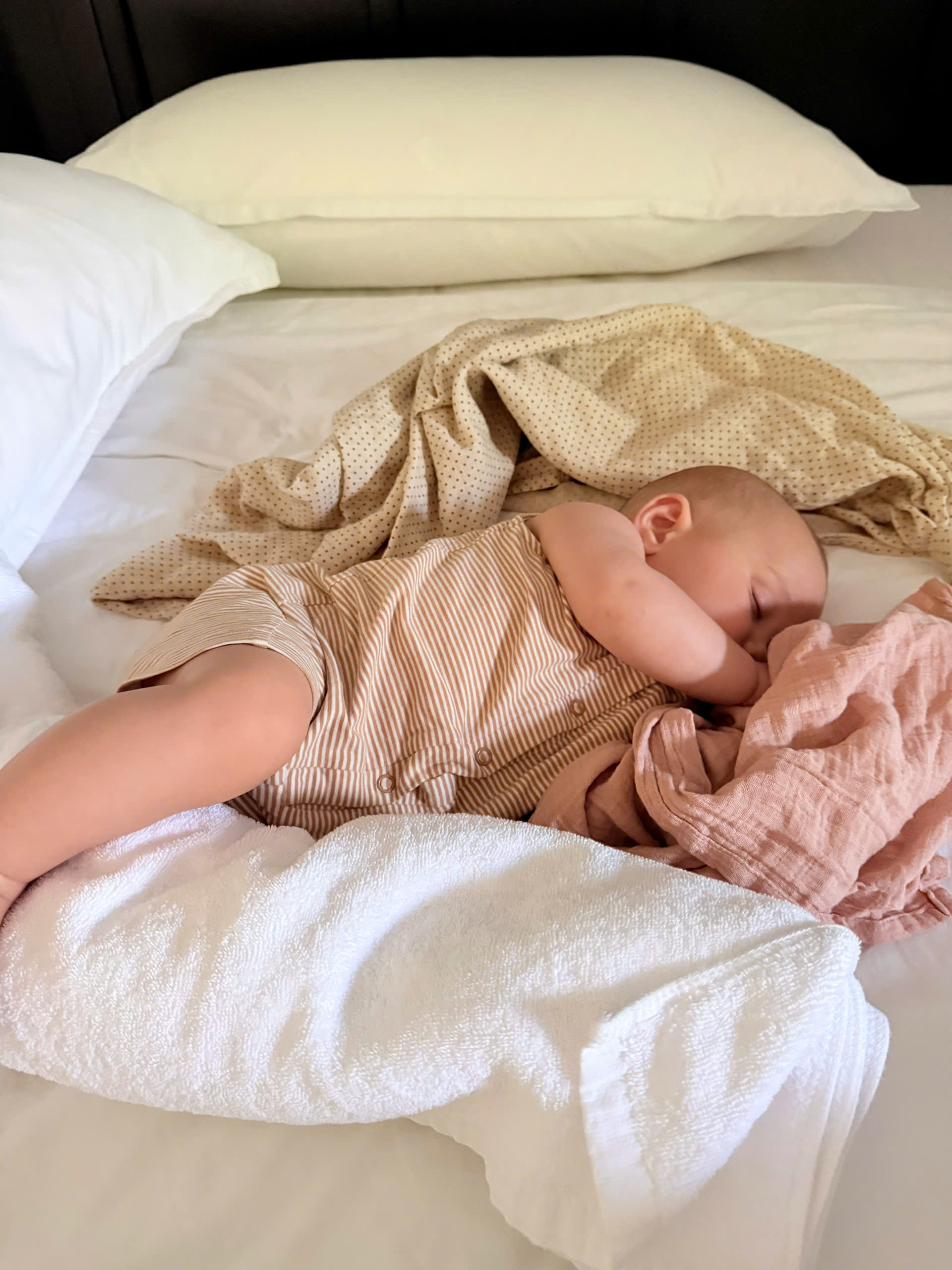 Private caregiver helping a child settle into a calm indoor moment during a resort holiday
