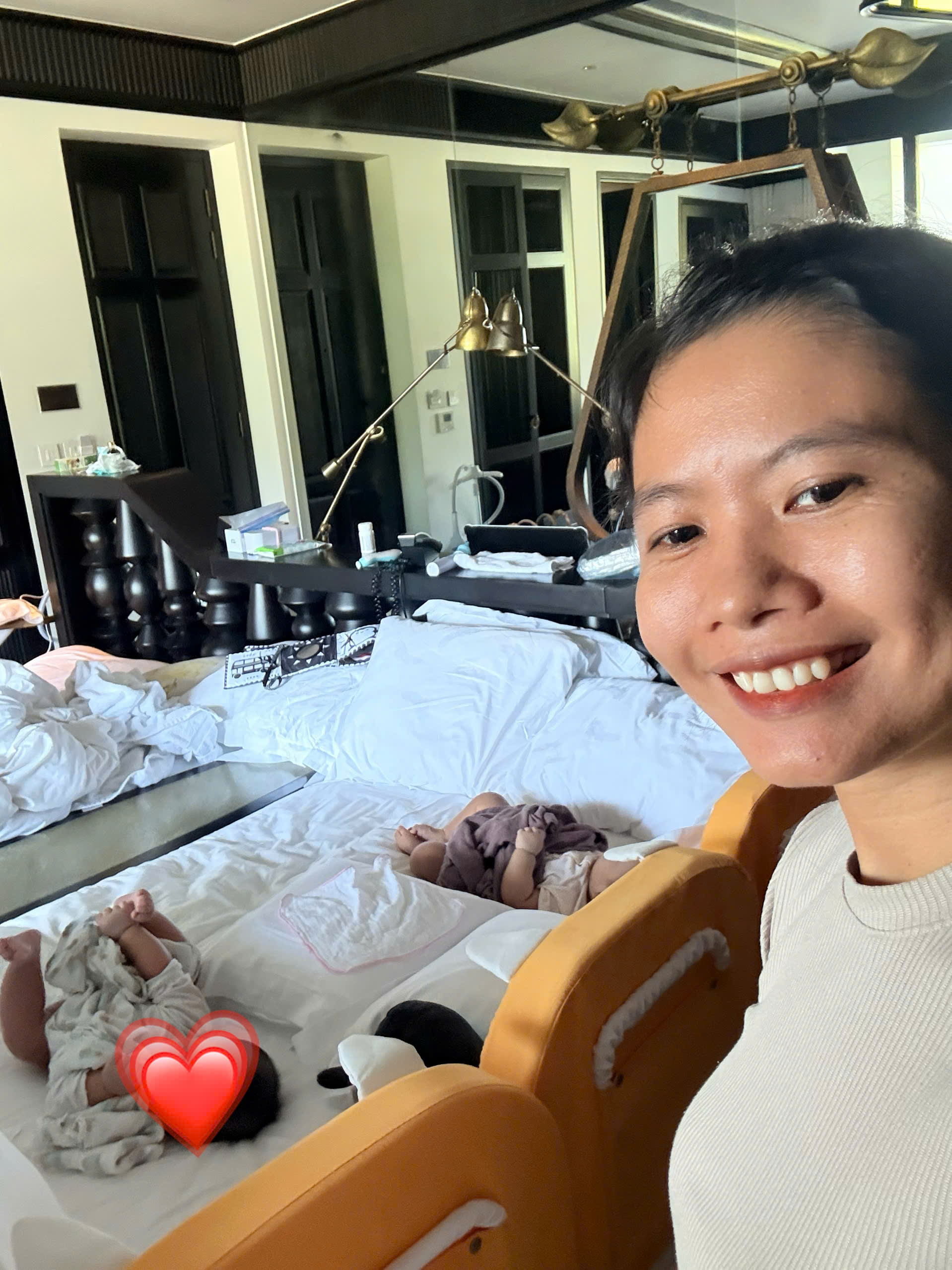 Twin baby babysitter in Da Nang supporting infant routine during resort stay