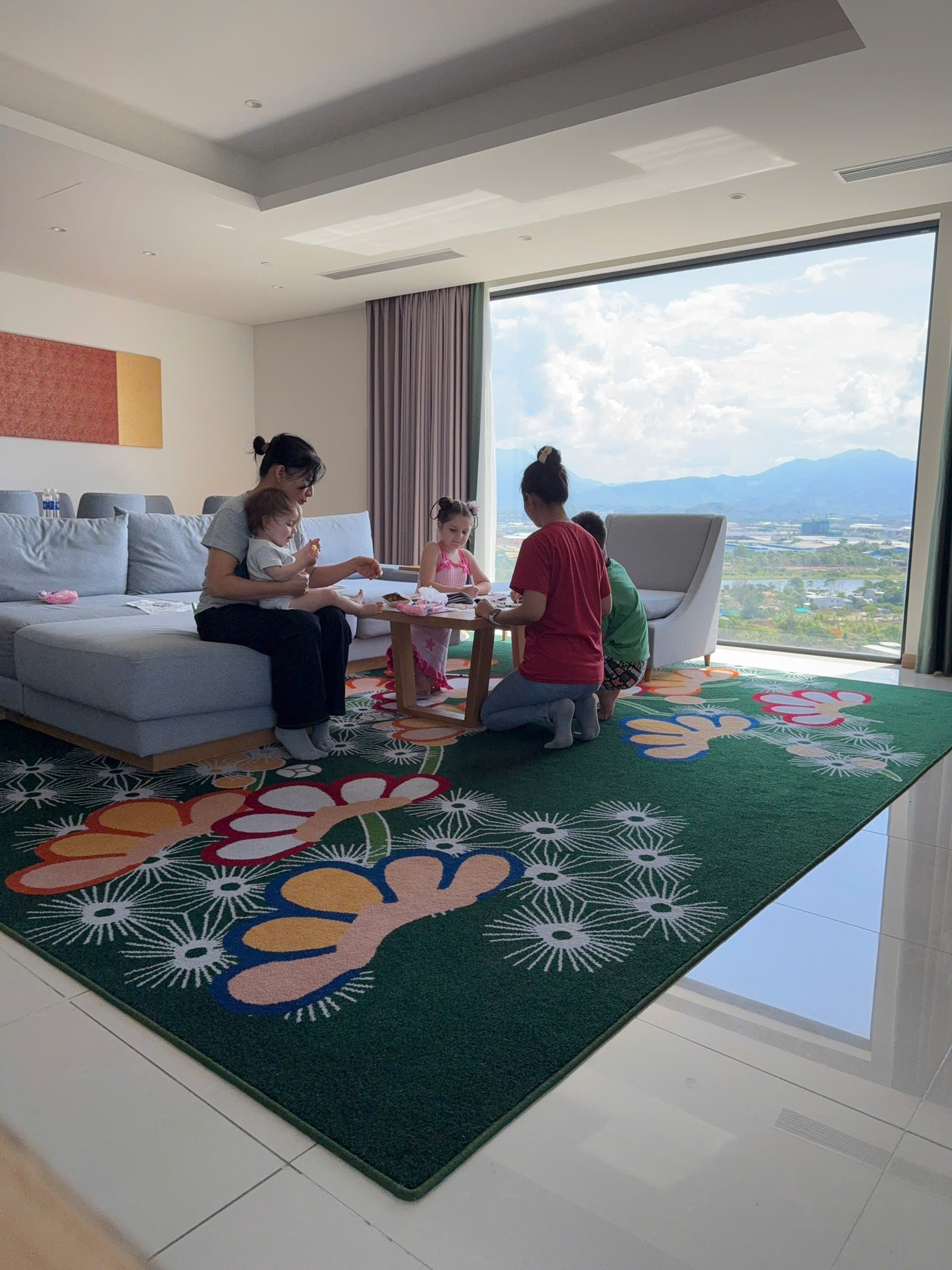 Children doing quiet indoor activities with babysitter support