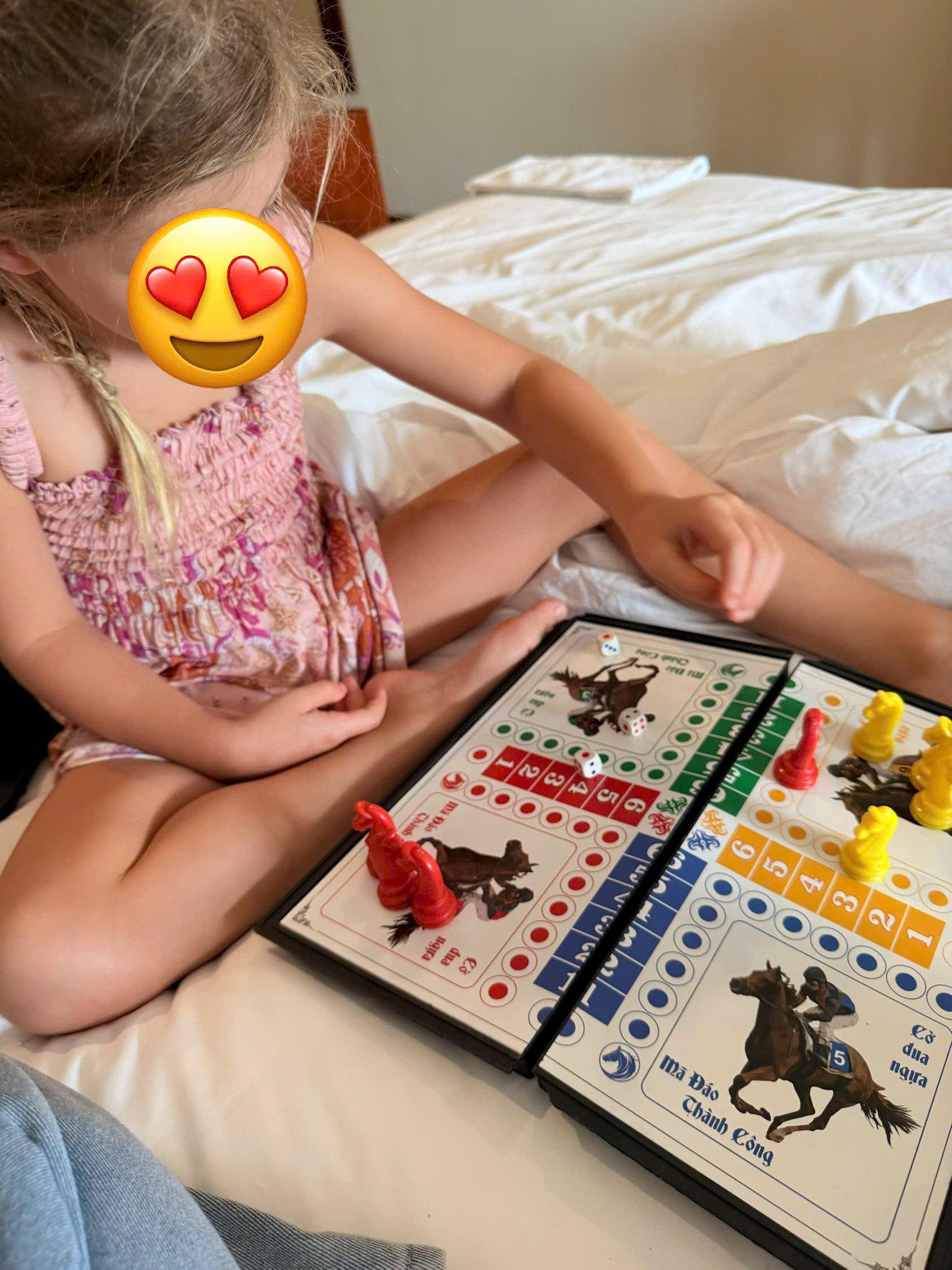 Five-year-old enjoying a creative makeup mask workshop with babysitter Annie