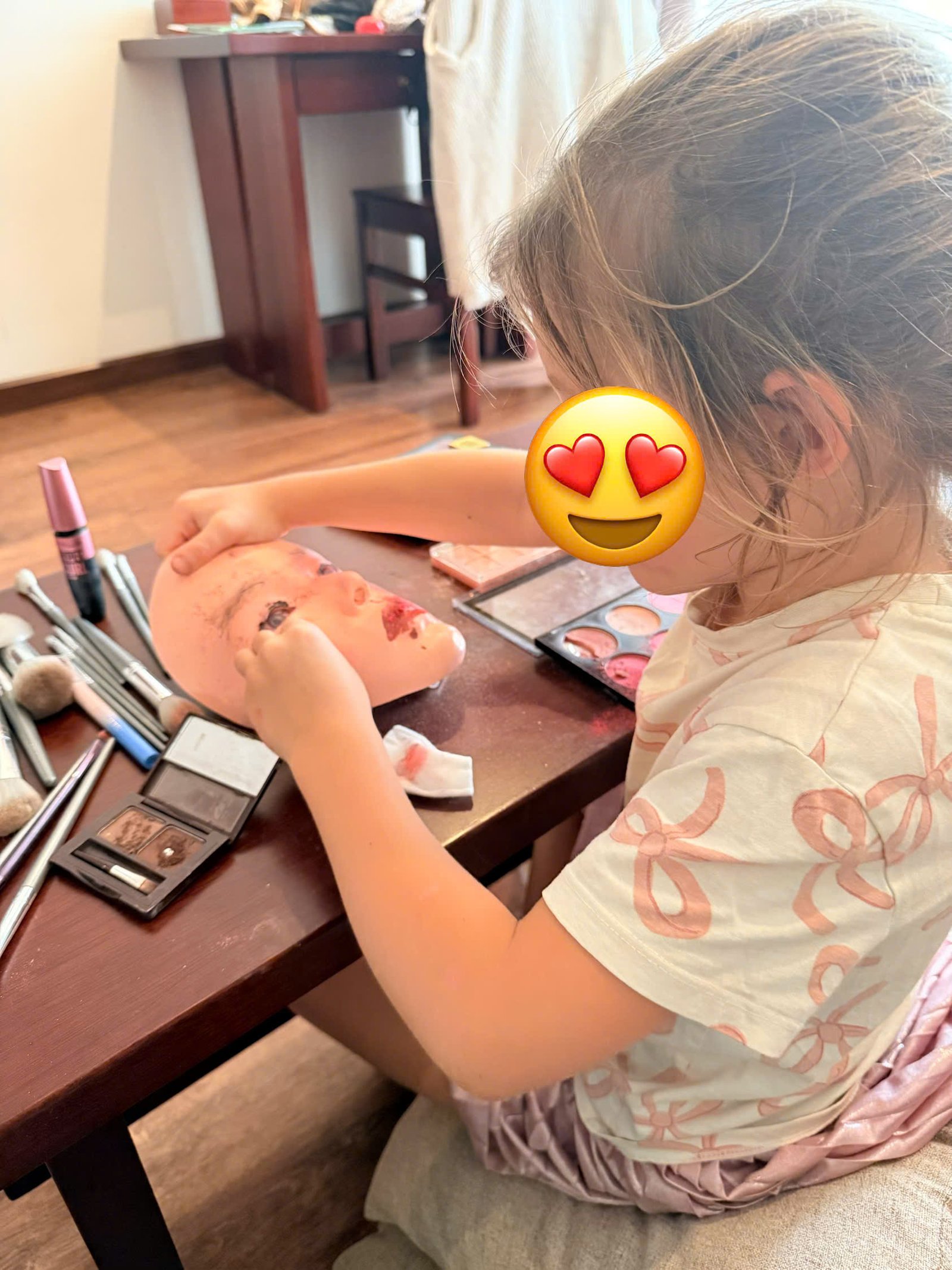 Five-year-old child playing a quiet board game with Annie at a Hoi An resort